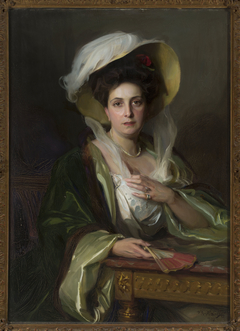 Portrait of a lady in a large hat by Philip de László