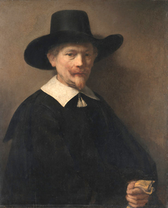 Portrait of a Man Holding Gloves by Rembrandt