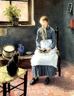 A reading Girl with a cat by Fritz von Uhde