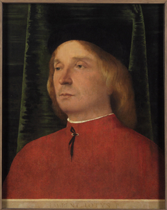 Portrait of a young man in red garment by Lorenzo Lotto