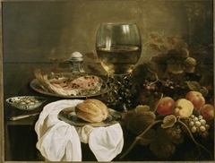 Still life with roemer, bread, fruit and salmon by Pieter Claesz