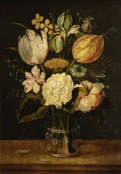 Flowers in a glass vase by Alexander Adriaenssen