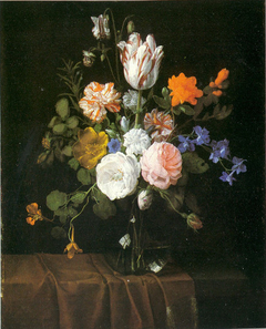 Flowers in a glass vase on a partly draped stone ledge by Nicolaes van Verendael