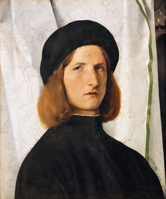 Portrait of a Young Man with a Lamp by Lorenzo Lotto