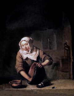 A Young Woman scouring a Copper Pot by Caspar Netscher