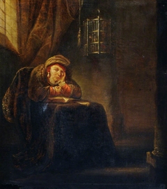 A Scholar seated at a Table by imitator of Rembrandt van Rijn