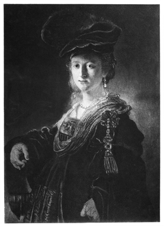 Half-length figure of a young woman in fanciful costume by Rembrandt