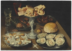 Oysters on a pewter plate with sweetmeats and biscuits in a silver tazza, chestnuts, nuts, and two façon-de-Venise wine glasses on a wooden table by Osias Beert