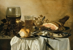 Still-life with ham, red herring and beer by Pieter Claesz