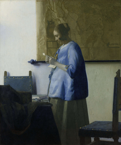 Woman in Blue Reading a Letter by Johannes Vermeer