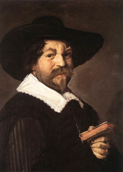 Portrait of a man holding a book by Frans Hals