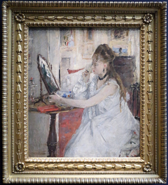 Young woman powdering by Berthe Morisot