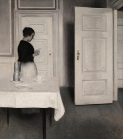 Ida Reading a Letter by Vilhelm Hammershøi