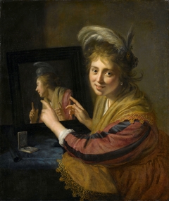 Girl at the mirror by Paulus Moreelse