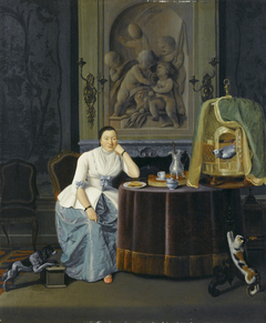 Interieur met een dame zittend aan een tafel by Hendrik Pothoven