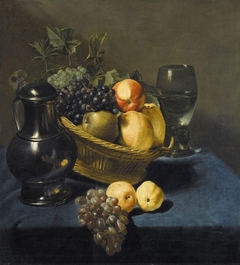 Still life with apples and grapes in a wicker basket on a table by Judith Leyster