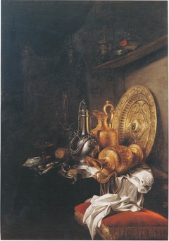 Still life with pewter canteen, gilt ewers and gilt silver plate by Willem Kalf