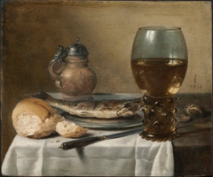 Still Life with Stoneware Jug, Wine Glass, Herring, and Bread by Pieter Claesz