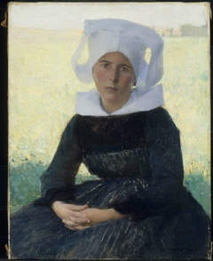 Woman in Breton Costume Seated in a Meadow by Pascal Dagnan-Bouveret