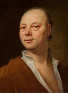 Portrait of a man in yellow coat. by Balthasar Denner