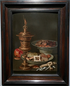 Still life with a gilt goblet, a pomegranate and Wan Li dishes with fruit, nuts and sweets, waarschijnlijk 1612 by Clara Peeters