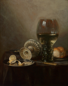 Still life with roemer, fallen tazza and lemon by Pieter Claesz