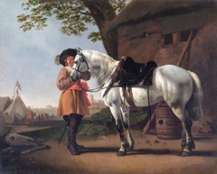 Landscape with a horse and a cavalier near a military camp by Abraham van Calraet