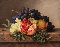 Pomegranates and green and blue grapes on a marble frame by Johan Laurentz Jensen